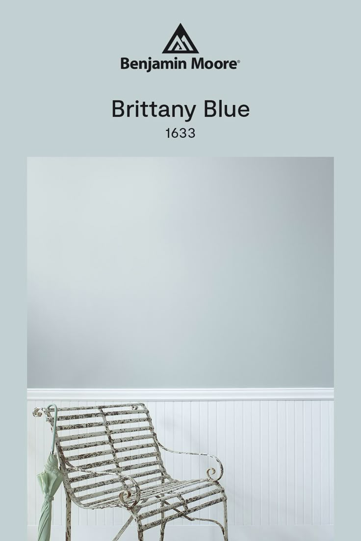 a chair sitting on top of a white floor next to a wall with the words britain blue