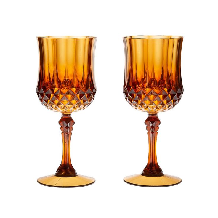 two brown glass goblets sitting next to each other