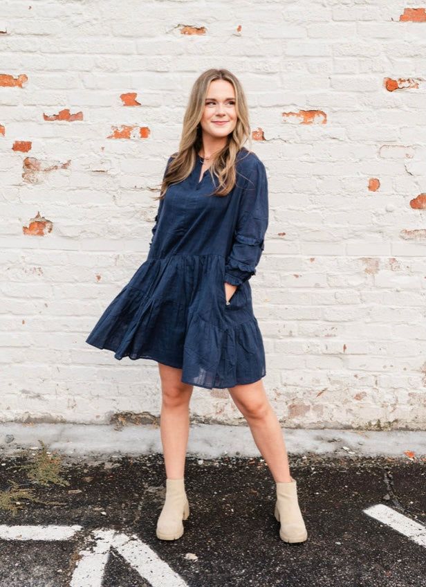 Get back to basics in our Navy Blu Dress. Crafted from breathable cotton, this loose-fitting garment is comfortable and stylish. Layer with our Ginger or Laurel Creek cardigans and pair with boots for a versatile fall outfit. Whether you're 5'2" or 5'8", you'll look and feel your best with a size that fits just right. (You won't want to miss this one!) To maintain the quality of this garment, use hand/delicate wash setting in cold with like colors; air dry; no bleach Not sure how this style will Casual Everyday Dresses For Fall, Navy Cotton Casual Dress, Blue Cotton Dresses For Fall, Blue Cotton Dress For Fall, Fall Dresses In Solid Color With Relaxed Fit, Fall Dress In Solid Color With Relaxed Fit, Cotton Dresses For Fall Day Out, Relaxed Fit Solid Color Fall Dress, Casual Relaxed Fit Dress For Fall