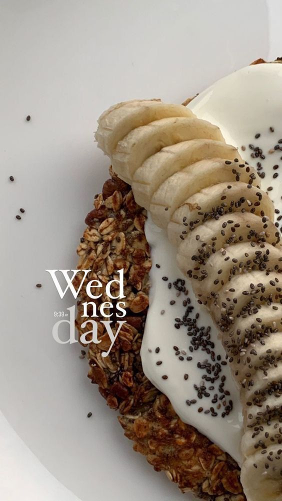 a white plate topped with bananas and granola