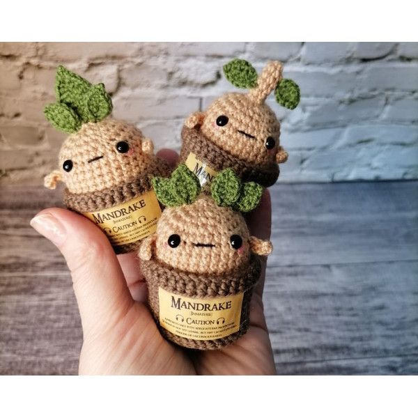 three little crocheted animals with leaves on their heads