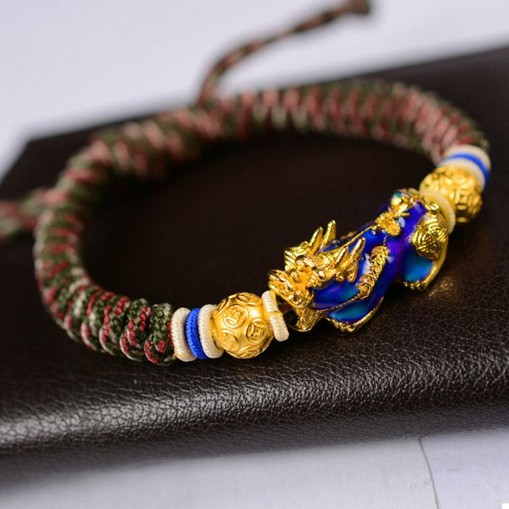 The Pi Xiu bracelet "Wealth and Abundance", carefully hand braided, is adjustable according to the size of your wrist thanks to its sliding thread system. Chic and easy to wear, this 24K gold-plated Pi Xiu protection bracelet will be an original and quality set for your wrist. ABOUT PI XIU This celestial animal is pronounced as “Pixiu” in Chinese. It is a mythical god beast in Chinese mythology, embodied with a dragon head, horse body and qilin’s feet, similar to a lion. Besides that, it has a b Adjustable Symbolic Gold Beaded Bracelets, Adjustable Braided Yellow Gold Jewelry, Adjustable Braided Gold Bracelets, Adjustable Gold Braided Jewelry, Adjustable Braided Gold Jewelry, Gold Bracelets With Adjustable Chain For Festival, Adjustable Yellow Gold Braided Bracelet With Jubilee Detail, Gold Hand-strung Friendship Bracelets As Gift, Gold Spiritual Friendship Bracelets For Festivals