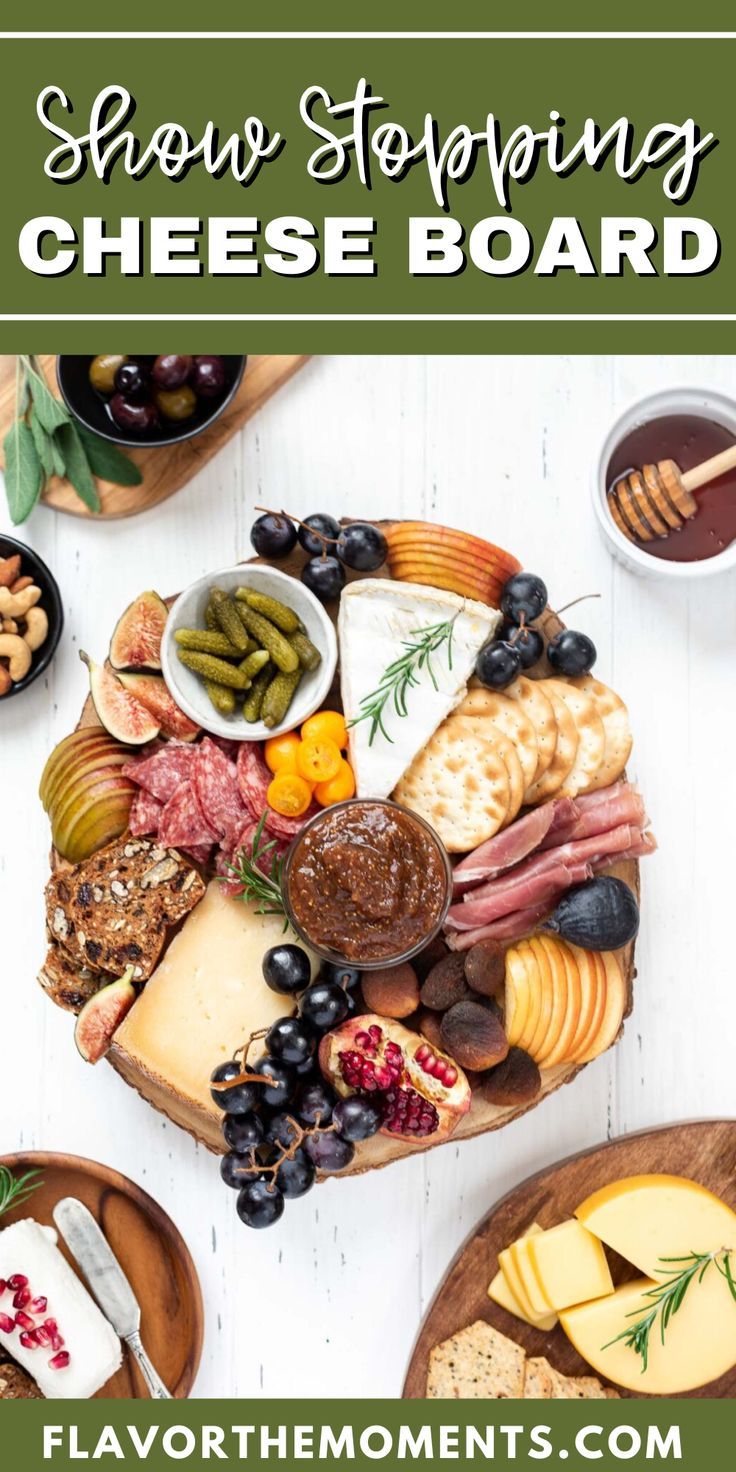 a cheese board with different types of meats, cheese and olives on it