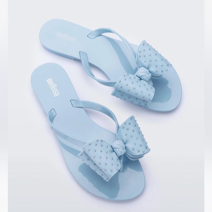 New In Box Light Blue Synthetic Flat Flip Flops, Cute Blue Round Toe Sandals, Light Blue Flat Flip Flops For Summer, Cute Blue Sandals For Vacation, Light Blue Flat Summer Sandals, Light Blue Synthetic Flip Flops For Summer, Cute Blue Non-slip Flip Flops, Cute Blue Flip Flops For Vacation, Cute Blue Flip Flops For Beach