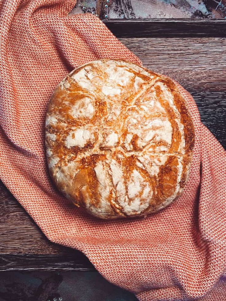 a loaf of bread sitting on top of a towel