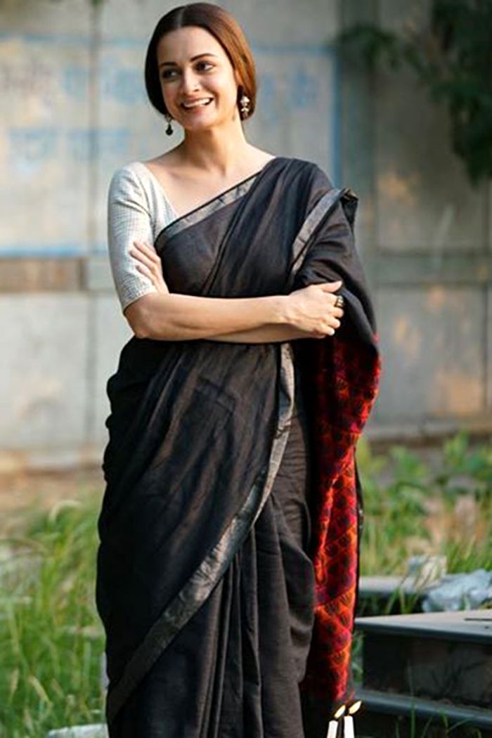 Dia Mirza's black sari from Thappad featured a contrasting pallu in an unexpected colour | VOGUE India Diya Mirza, Black Sari, Formal Saree, Cotton Saree Blouse Designs, Best Films, Wedding Wardrobe, Saree Wearing Styles, Cotton Saree Blouse, Saree Wearing