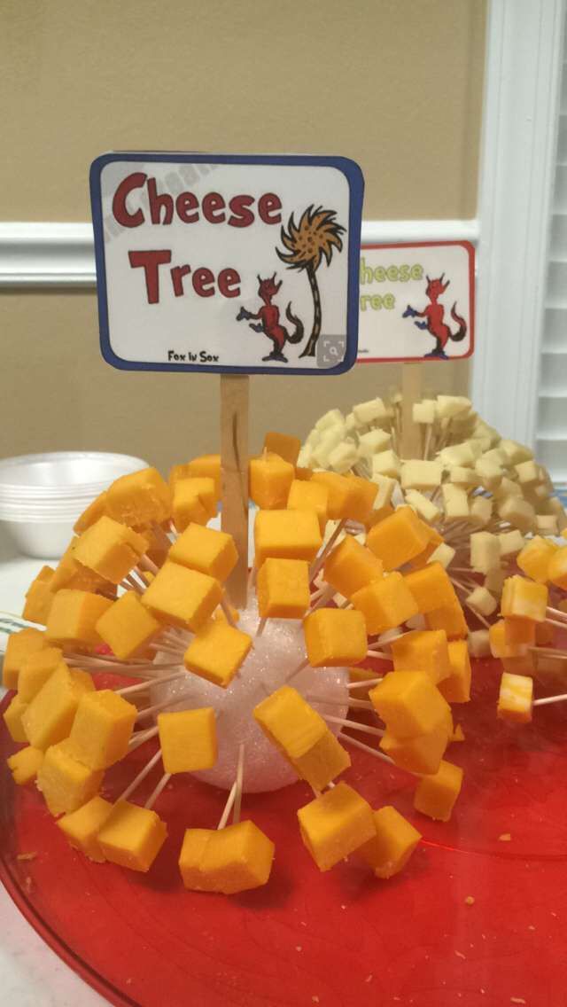 cheese tree displayed on red platter with sign