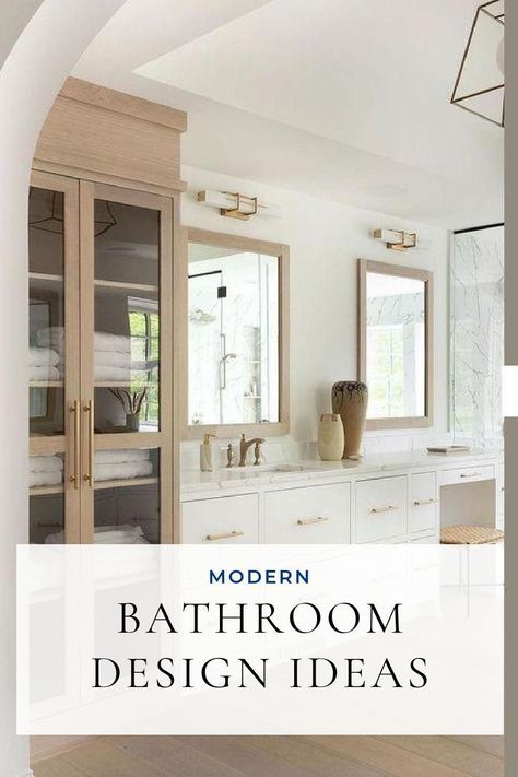 a bathroom with white cabinets and wooden floors