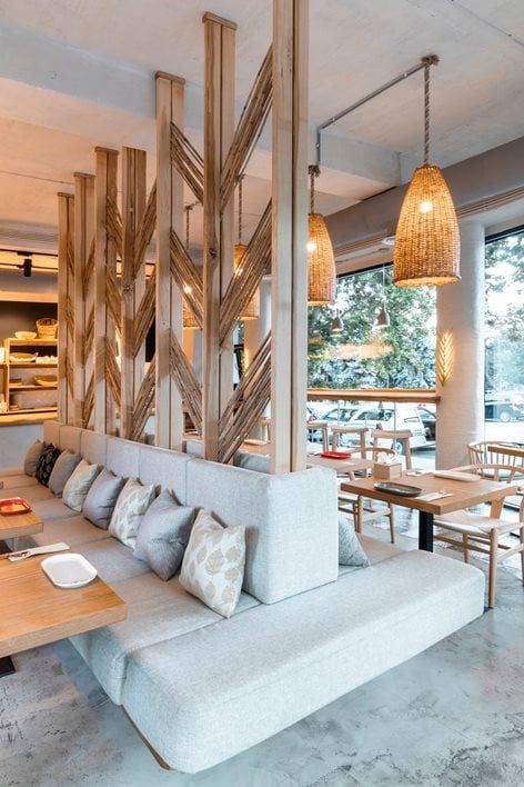 the restaurant is decorated with wood and white furniture