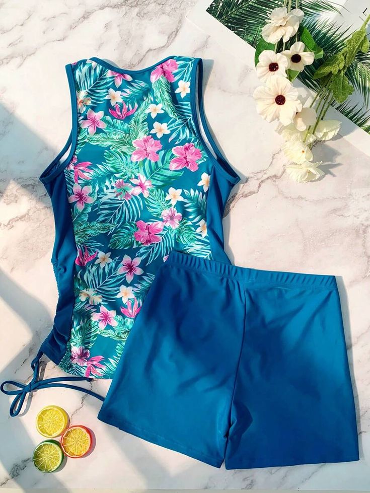 SHEIN USA Blue Stretch Tropical Tankini, Blue Tropical Stretch Tankini, Blue Stretch Tropical Print Swimwear, Blue Tankini For Beach Party Vacation, Blue Sleeveless Swimwear For Vacation, Blue Sleeveless Tankini With Tropical Print, Blue Fitted Tankini With Tropical Print, Fitted Blue Tankini With Tropical Print, Blue Floral Print Tankini For Beach Season