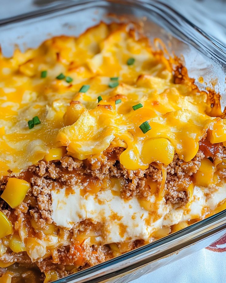 a casserole dish with meat, cheese and vegetables