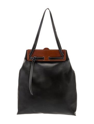 Loewe ToteBlack LeatherFlat Handles & Dual Shoulder StrapsSuede Lining & Single Interior PocketDrawstring Closure at TopIncludes Dust BagUnfortunately, due to restrictions, this item may not be eligible for shipping in all areas. Tote Handbags, Print Patterns, Women Handbags, Handles, Handbags, Leather, Black