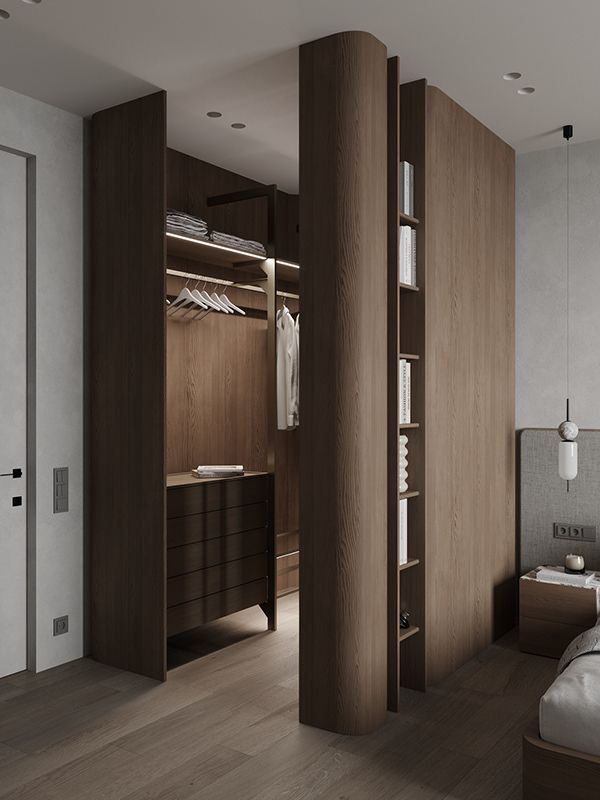 a bedroom with a bed and closets in the corner, next to a walk - in closet