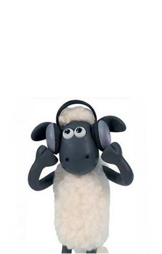 a black and white sheep with headphones on it's ears is standing in front of a white background