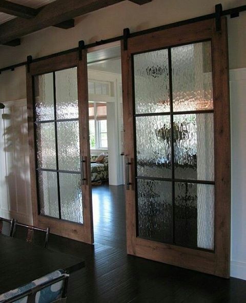 an empty room with sliding glass doors in it