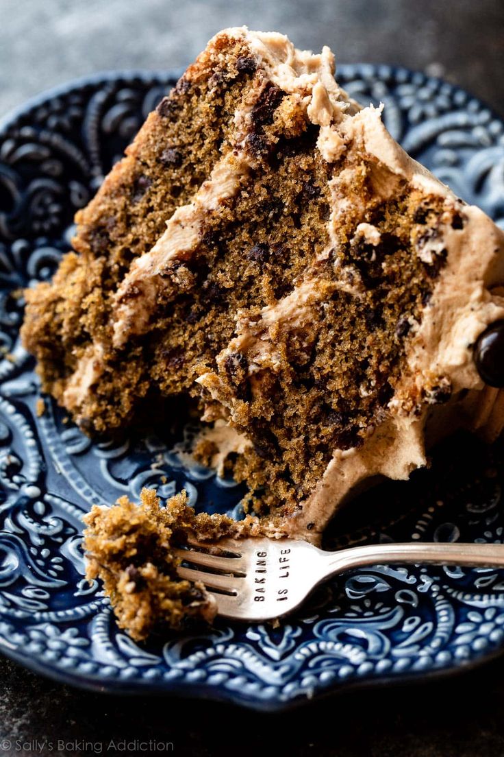 a piece of cake on a blue plate with a fork