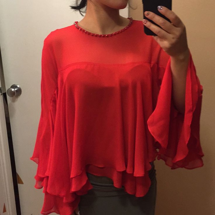 Nwt. In Perfect New Condition. True Red Color. True To Size Xs. Neckline Is Embellished. Poncho Style Blouse Top. Soft And Comfortable. 22” Long. No Trades. Elegant Red Party Tops, Elegant Red Evening Top, Elegant Red Tops For Evening, Elegant Red Top For Evening, Glamorous Red Blouse, Chic Red Party Blouse, Elegant Red Blouse For Night Out, Glamorous Red Blouse For Party, Glamorous Red Summer Top