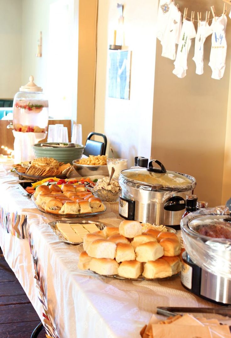 a table full of breads, rolls and other food on it's side