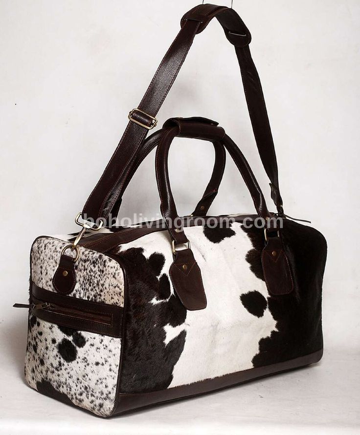 Make a statement on your travels with our stunning black and white cowhide weekender bag, a must-have accessory for western events or southern-themed getaways. - Free shipping on all our cowhide duffle bags. - Dimensions: 20 Inches x 11 Inches x 10 Inches. - Detachable real leather shoulder straps and handles. - inside cloth lining with 1 zipper pockets and 2 open pockets. - 2 exterior open pockets. - real leather base. - It takes approx seven business days to complete each cowhide duffle bag. - Rectangular Cow Print Travel Bag, White Leather Weekender Bag With Luggage Sleeve, White Leather Rectangular Weekender Bag, Large Capacity White Leather Weekender Bag, Luxury White Leather Travel Bag, Large Capacity White Leather Travel Bag, White Leather Duffle Bag For Travel, White Leather Travel Duffle Bag, White Leather Travel Bag