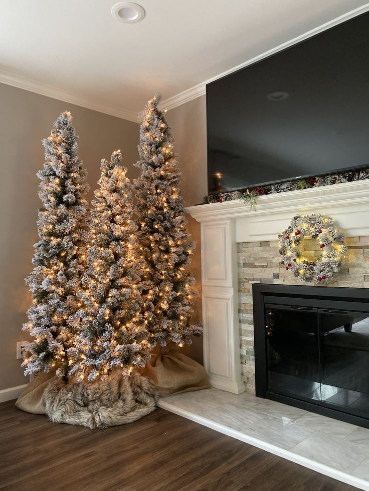 a christmas tree in front of a fireplace