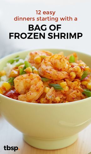 a bowl filled with shrimp and vegetables on top of a table