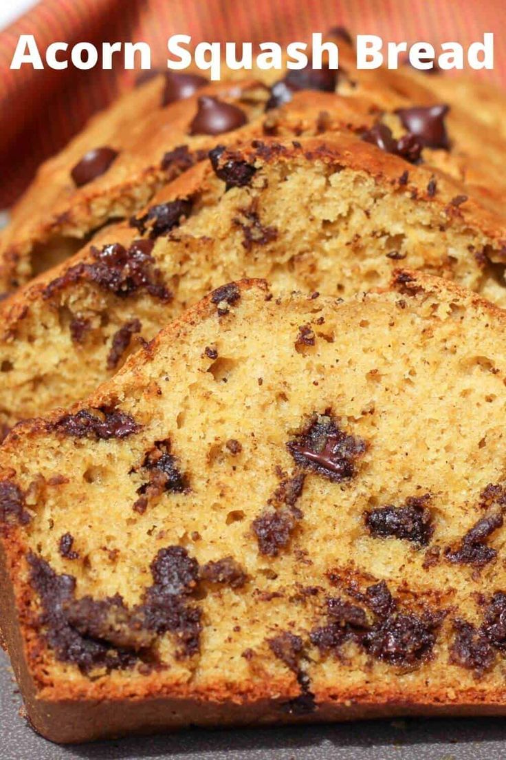 a loaf of bread with chocolate chips on top and the words acorn squash bread above it