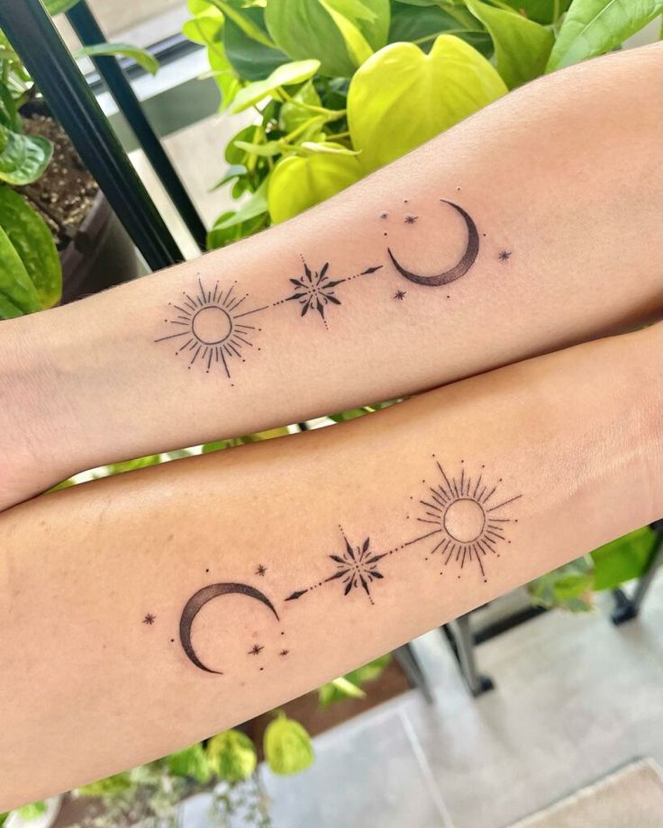 two sun and moon tattoos on both arms