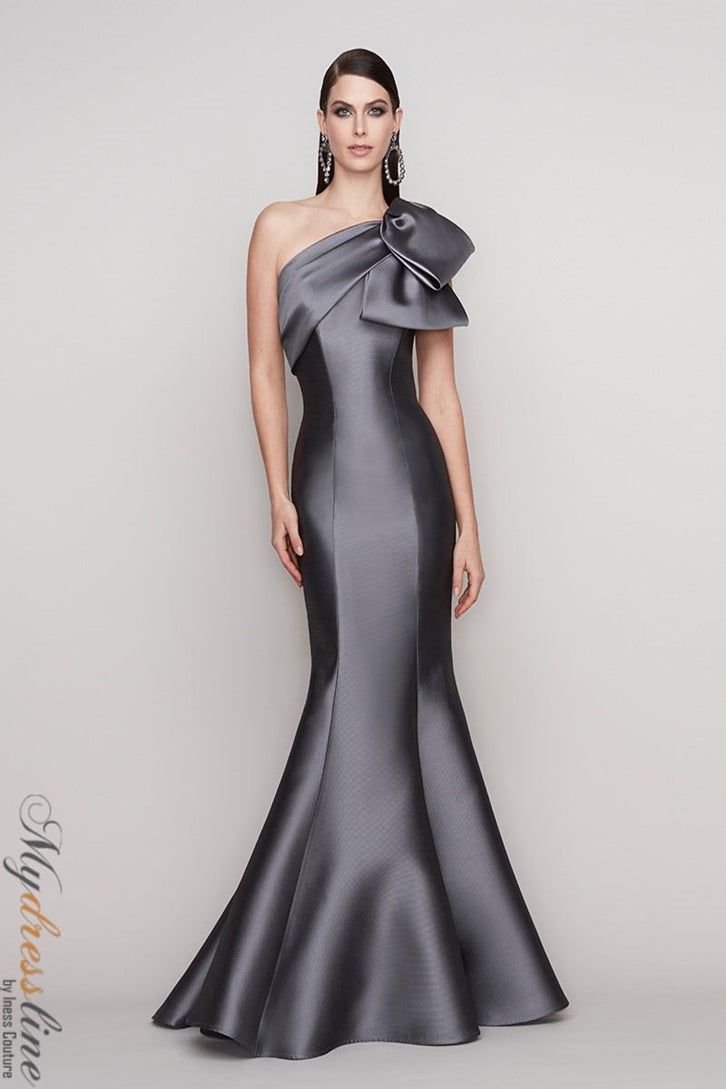 Looking for a show-stopping dress for your next big event? Check out the Frascara 4134 One Shoulder Gown! This gorgeous dress features a draped bodice with a bow, and a fit and flare silhouette that is sure to turn heads. The hidden back zipper and satin lining make it both comfortable and chic. Made from 87% polyester and 13% silk, this dress is sure to make you feel like a million bucks! One Shoulder Gown, Mob Dresses, فستان سهرة, Mermaid Skirt, Dresses Elegant, Evening Dresses Elegant, Modern Dress, Floor Length Dresses, Dress Cover