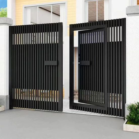 two black gates are open in front of a house