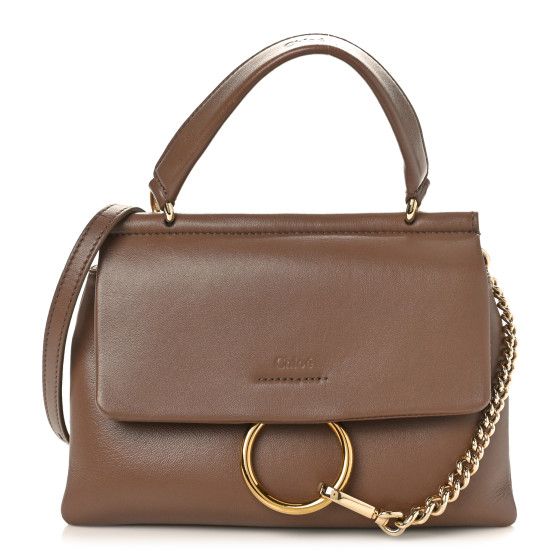 This is an authentic CHLOE Lambskin Small Faye Top Handle Bag in Brown. This stylish handbag is crafted of lambskin leather in brown with a front flap. It features a leather top handle, an adjustable leathershoulder strap, and a decorative draping gold chain that clips to the gold ring closure.This shoulder bag opens to a beigefabric interior with a patch pocket. Brown Calf Leather Shoulder Bag With Branded Hardware, Designer Brown Flap Bag With Detachable Handle, Brown Satchel With Gold-tone Hardware And Round Handle, Brown Satchel With Round Handle And Gold-tone Hardware, Designer Brown Flap Bag With Top Handle, Brown Top Handle Flap Bag With Branded Hardware, Brown Top Handle Shoulder Bag With Branded Hardware, Designer Brown Top Handle Flap Bag, Luxury Brown Shoulder Bag With Round Handle