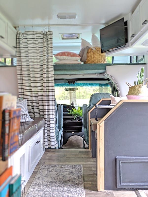 the interior of a camper van is clean and ready for people to use it