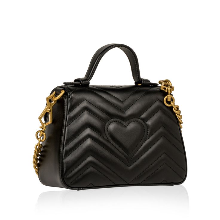 Carefully crafted from smooth, matelassé leather featuring Gucci's signature GG logo, the Marmont has been the bag on every It-Girl's "must-have" list. Featuring a square silhouette, tiny top handle, and long chain / leather strap, the Marmont is the ultimate "cool" bag. Perfect for a young, edgy woman with a fashion forward sense of style. Carry all your small every day essentials inside the interior compartment while remaining sleek and stylish. The ideal accessory to compliment pretty much anything in your wardrobe, the Marmont is a sure statement to all eyes will be on you no matter where you go. A classic style from Gucci, the GG Marmont is a well-worthy addition to any luxury handbag collection that you definitely need in your life. SPL Exterior Black matelassé leather Antique gold t Edgy Woman, Cool Bag, Handbag Collection, Gg Logo, Gg Marmont, Dior Shoes, Timeless Handbag, Exclusive Bag, Leather Chain