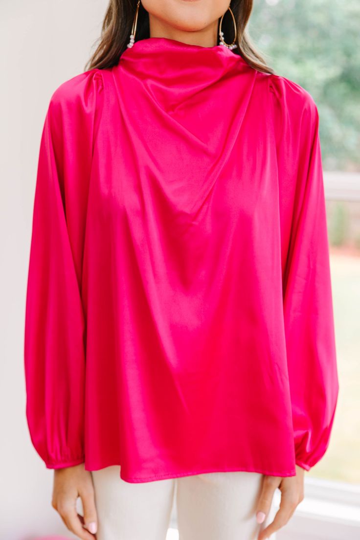 Embrace they joy that this blouse is going to bring! That satin fabric is so luxurious especially with that draped neckline! This bubble sleeve blouse is going to look amazing at the office or a nice restaurant! This blouse features long bubble sleeves, a draped cowl neck, a button keyhole back, and a sleek satin fabric. Material has no amount of stretch.Sydney is wearing the small. Formal Fall Tops With Draped Sleeves, Formal Tops With Draped Sleeves For Fall, Elegant Draped Fall Blouse, Chic Cowl Neck Evening Blouse, Chic Evening Blouse With Cowl Neck, Chic Draped Blouse For Fall, Pink V-neck Blouse For Formal Occasions, Elegant Pink Long Sleeve Blouse, Elegant Long Sleeve Pink Blouse