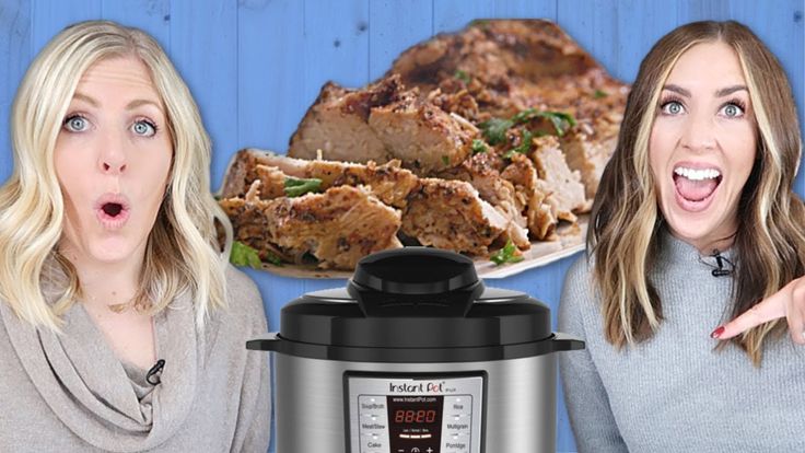 two women standing next to an instant pot roaster