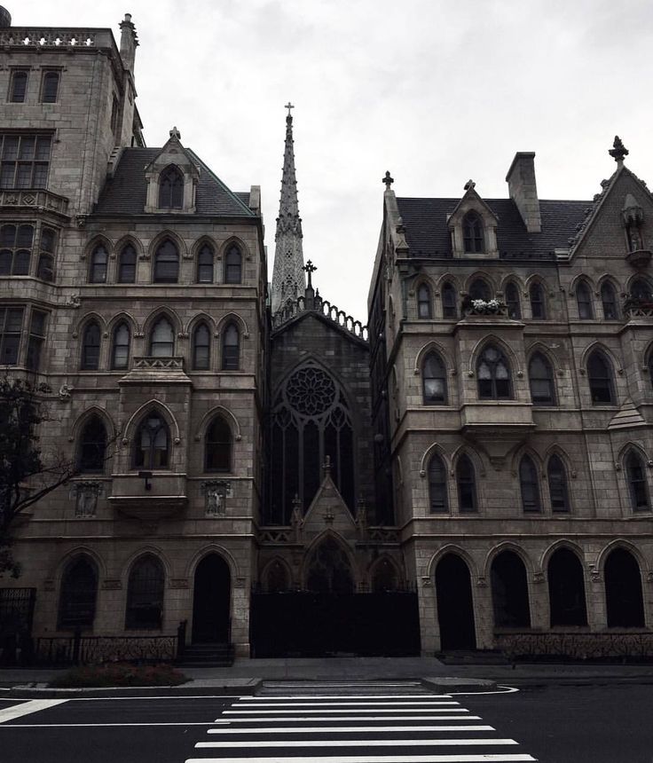 an old building with many windows and a steeple