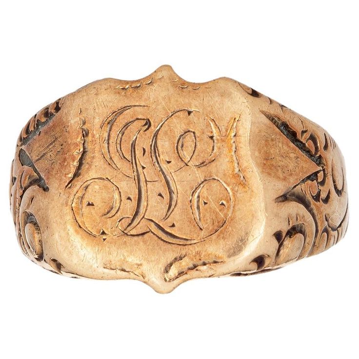 Lovely antique Victorian shield signet ring (circa 1880s to 1900s), crafted in 14 karat rose gold. From what we can decipher, the center shield is engraved with the initials "SL". The side shoulders feature a pretty scrolling design that terminates to the shield mount. The saddle of the ring is low and curves to the shape of the finger. The ring is in good condition with patina and wear evident. We have not cleaned the ring in order to preserve the patina and collector value. Particulars: Weight Vintage Fine Jewelry, Gold Signet Ring, The Shield, Rich Girl, Antique Victorian, Gold Gold, Signet Ring, Art Vintage, Antique Gold