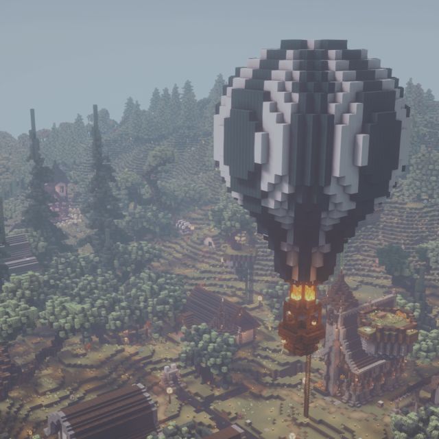 an image of a hot air balloon flying in the sky over a town and forest