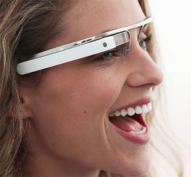 a woman wearing google glasses looking to the side