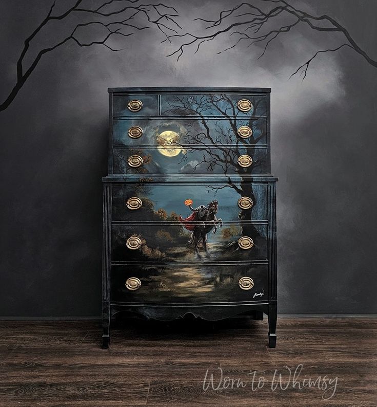 an artistic dresser with a painting on it