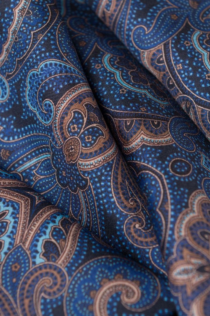 Add some Italian style to your outfit with this sophisticated silk scarf. Make a statement with this classic and timeless paisley print scarf. 100% Made in Italy. Sized for a perfect drape: Approx: 8.5” x 70”. This allows for an elegant look that sets you apart. Most men's scarves of this type are available in a 60"-63" length which is simply too short for most men for adequate coverage and drape. 100% silk twill: A soft, silky fabric traditionally used in men's tailoring for its look and its dr Blue Silk Scarf With Paisley Print, Formal Silk Scarf With Paisley Print, Formal Paisley Print Silk Scarf, Elegant Blue Paisley Print Scarves, Elegant Silk Scarf With Paisley Print, Elegant Silk Scarves With Paisley Print, Elegant Patterned Silk Fabric, Elegant Blue Silk Pocket Square, Elegant Patterned Silk Scarf With Paisley Print