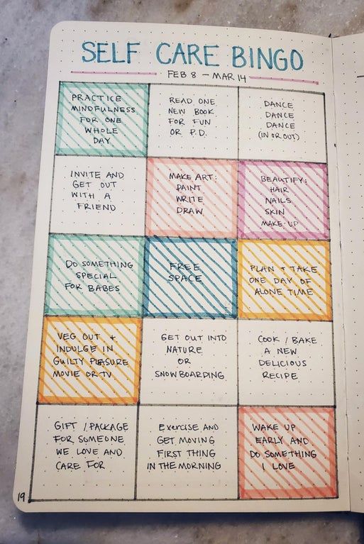 a notebook with some writing on it and the words self care bingo written in different colors