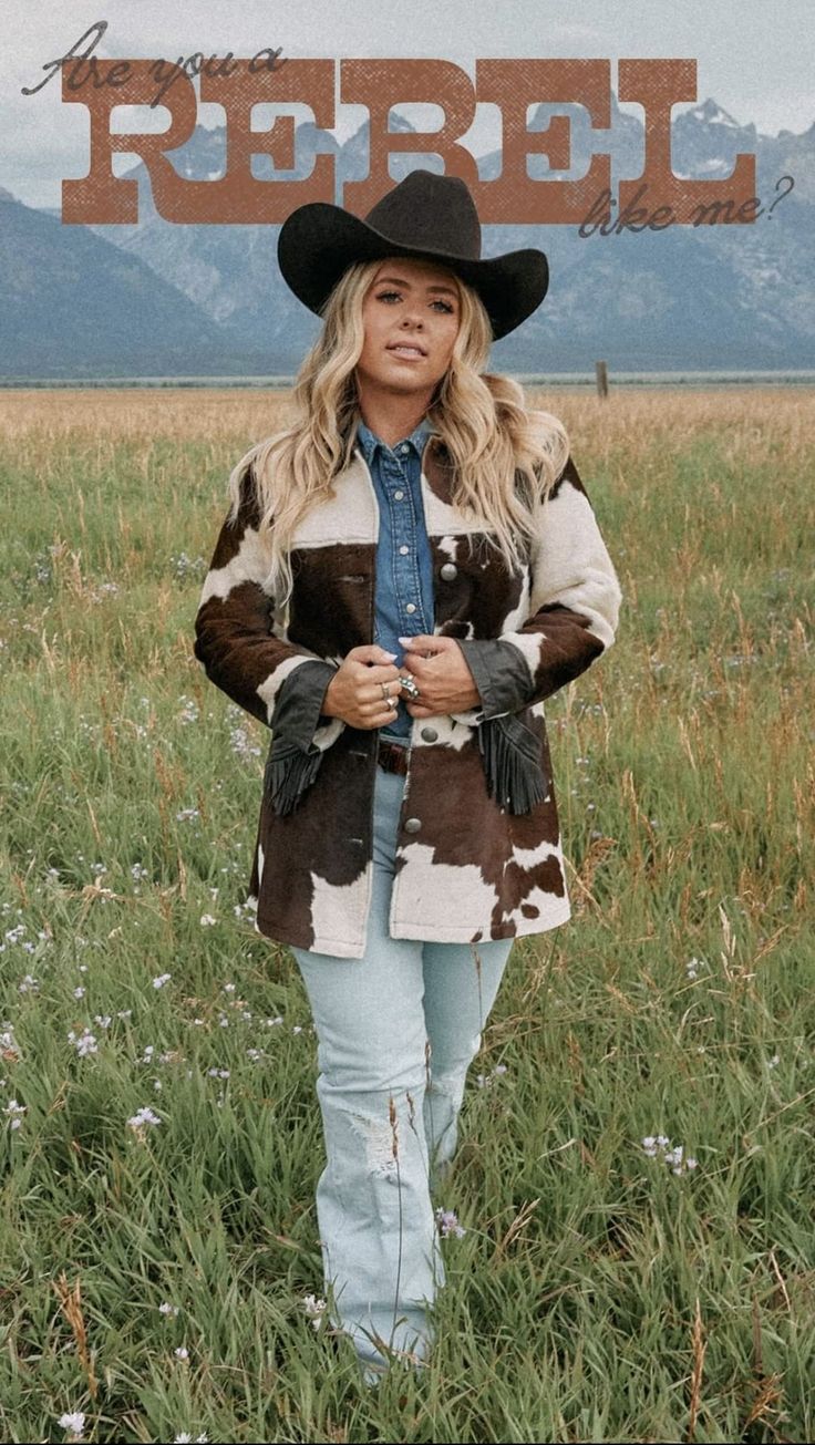 a woman wearing a cowboy hat standing in a field with the words rebel on it