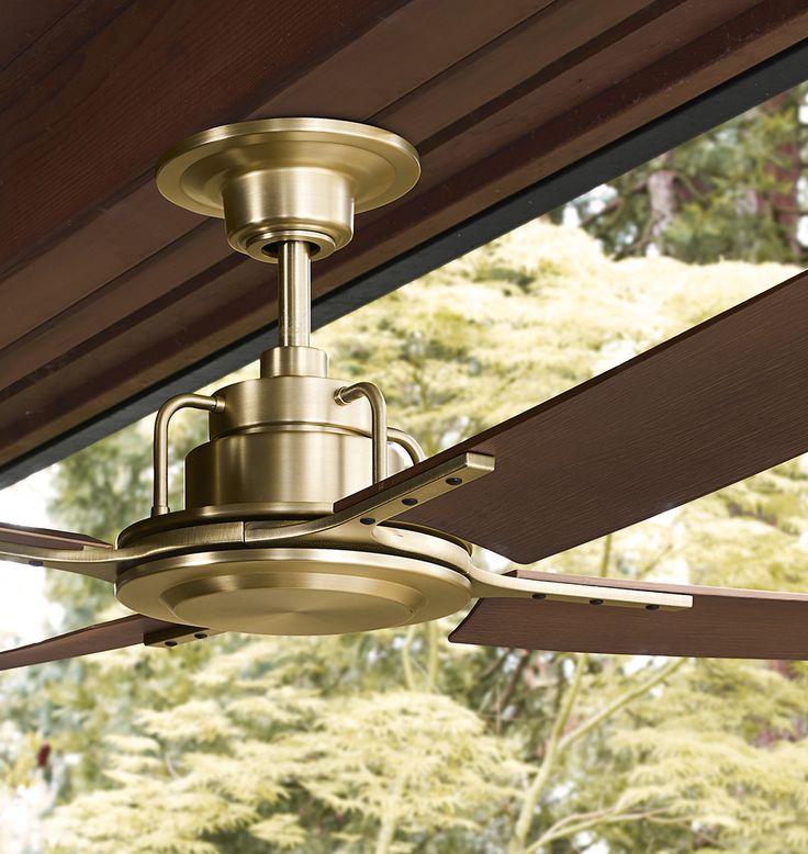 a ceiling fan with the words freeze on it and an image of trees in the background