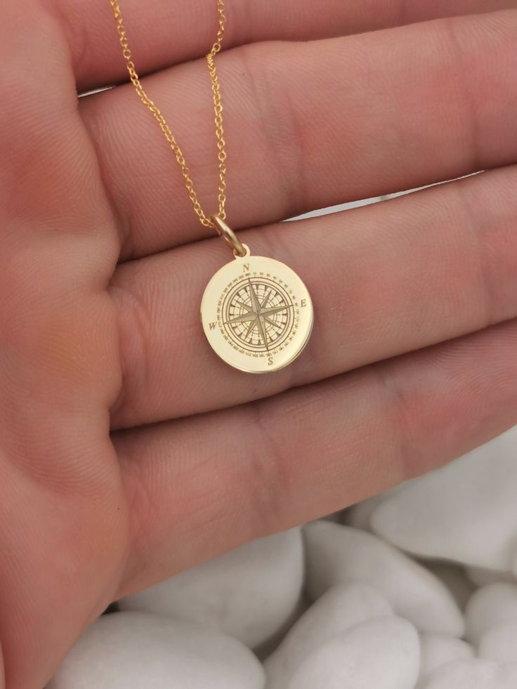 "14K Solid Gold Compass necklace, compass jewelry, compass gift, compass charm, personalized compass, custom pendant, traveler gift 14k Solid Gold Choose What Size You Want the Pendant Using The Second Option Box Photos Are For The 0.5 inch Diameter Pendant Pendant thickness : 0.5mm Inner diameter of jump ring : 4mm ♥ Material of pendant and chain: Solid Gold k14 ♥ Packaging: All of our jewelry are beautifully boxed and ready for gifting For more personalized designs take a look here: ♥ www.etsy Gold Compass Necklace, Compass Jewelry, Phoenix Jewelry, Custom Pendant, Compass Pendant, Compass Necklace, Custom Pendants, Jewelry Inspo, Gold Pendant Necklace