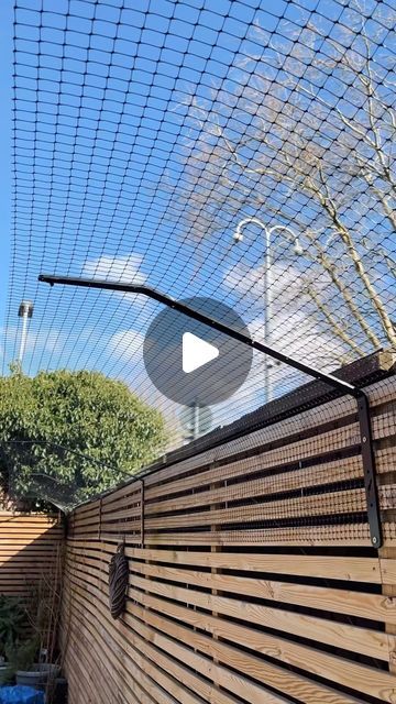 a wooden fence with metal bars on it