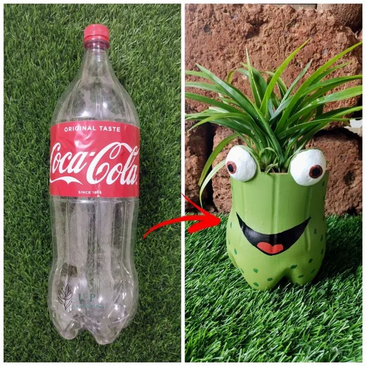 an empty coca - cola bottle and a fake plant