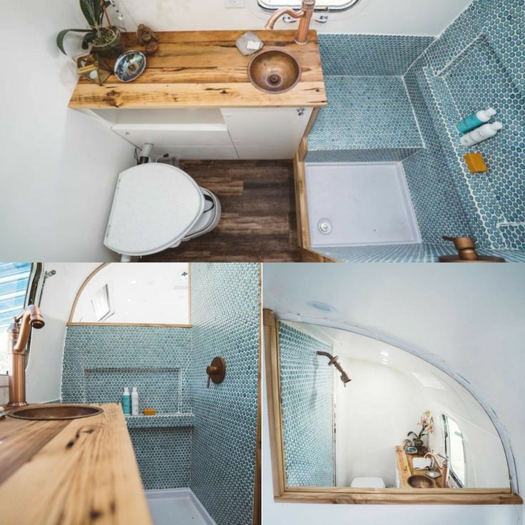 this bathroom has blue tiles on the walls and wood flooring, along with a wooden counter top