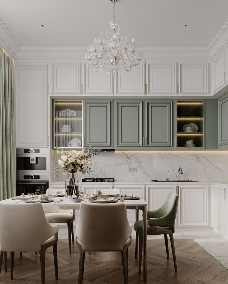 a dining room and kitchen area with green cabinets, marble counter tops and white chairs