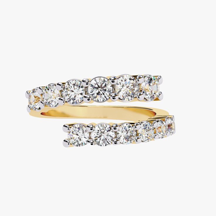 two yellow gold rings with diamonds on each side and one white diamond in the middle