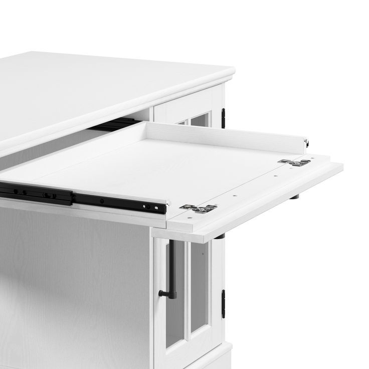 an open drawer on the side of a white desk